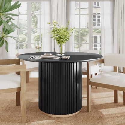 - Malcolm round Pedestal Dining Table.