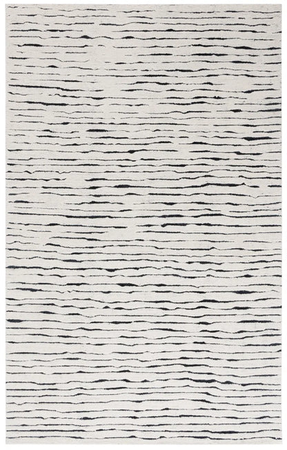 Transform Your Space with the Casablanca Hand Tufted Wool Pile Abstract Rug - 5' x 8' Elegance in White